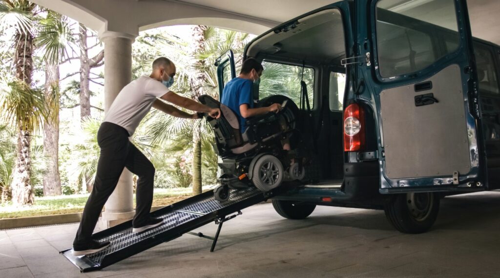 Man on wheelchair using accessible vehicle